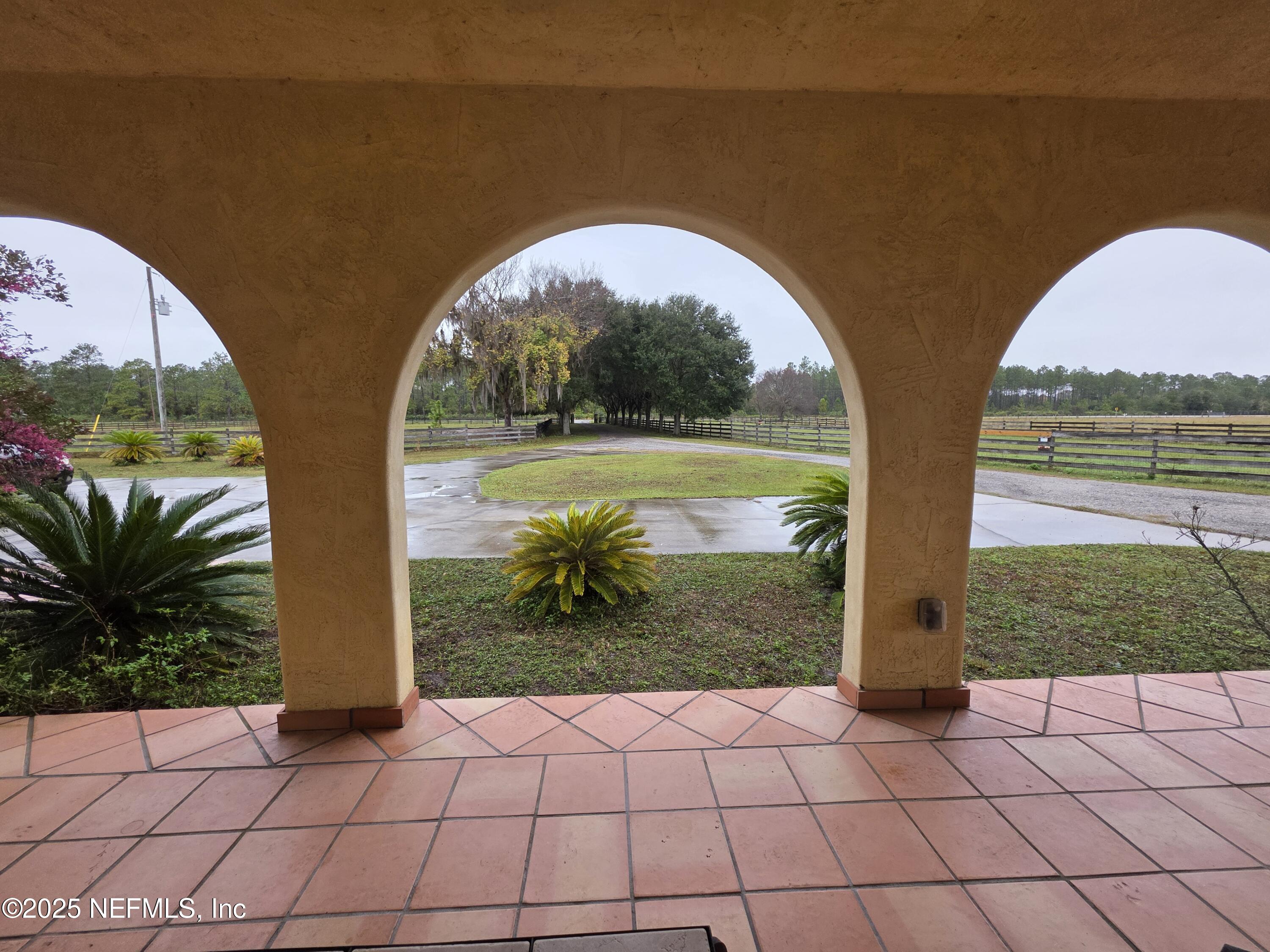 721 Bunnell Road Pierson, FL 32180 - Photo 48 of 59 a view of a yard and dinning table under an umbrella