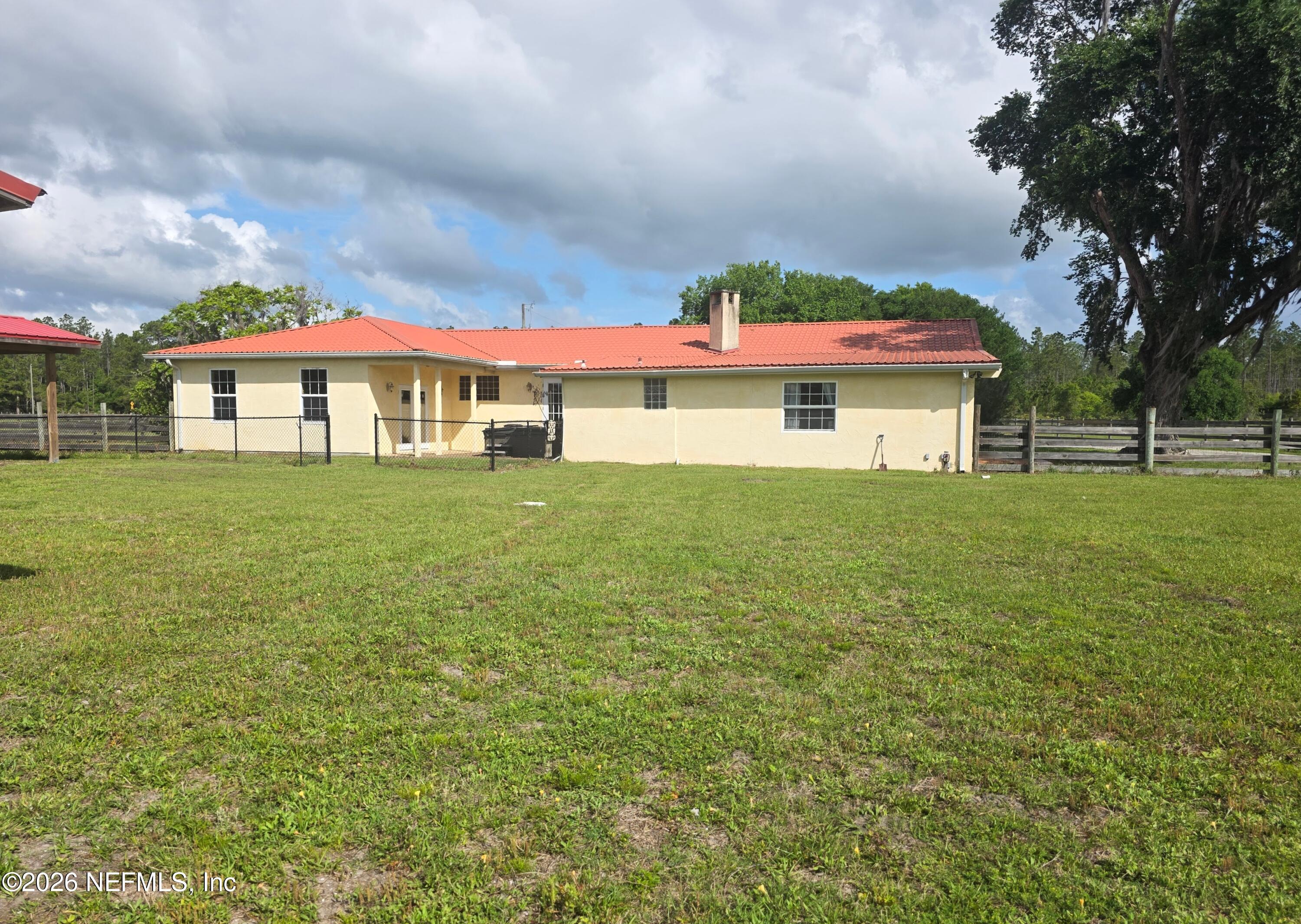 721 Bunnell Road Pierson, FL 32180 - Photo 57 of 59 a front view of a house with a yard