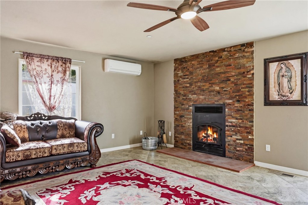 26200 Morgan Valley Road Lower Lake, CA 95457 - Photo 13 of 69 a living room with furniture and a fireplace