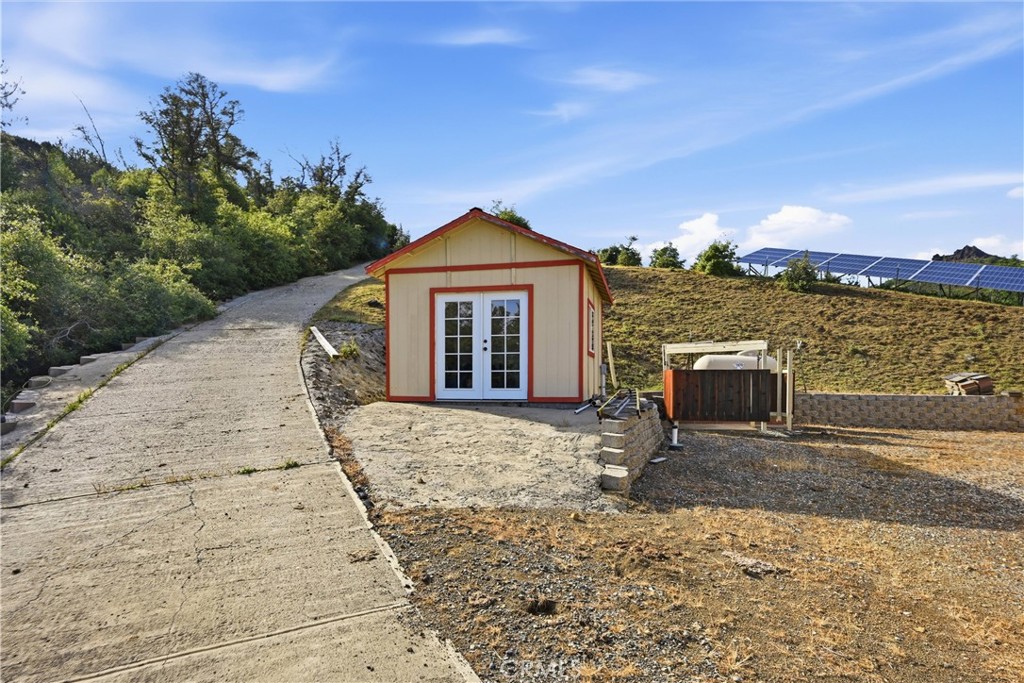26200 Morgan Valley Road Lower Lake, CA 95457 - Photo 46 of 69 a front view of a house with a yard