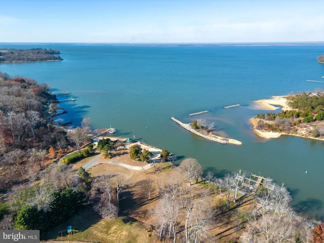 an aerial view of a house with ocean view