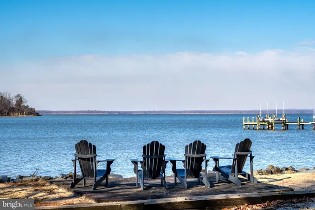 a view of swimming pool with outdoor seating