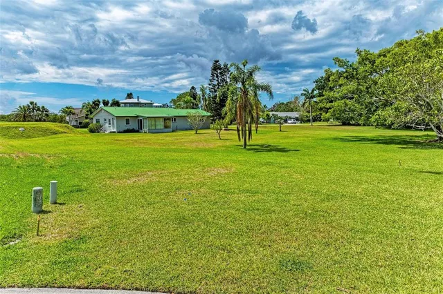 a view of a garden with a building in the background