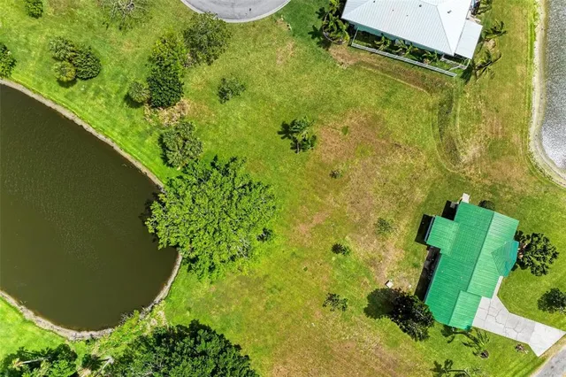 an aerial view of a residential houses with outdoor space