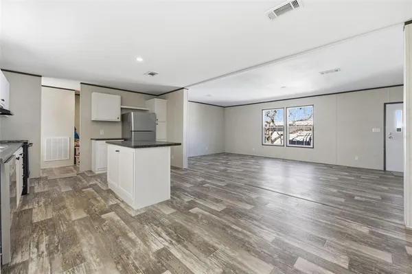 a view of kitchen with furniture and wooden floor
