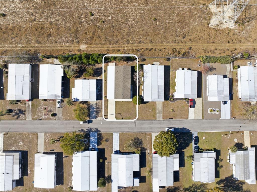 8551 Electra Avenue Brooksville, FL 34613 - Photo 18 of 54 a bathroom with a granite countertop double vanity sink and a mirror