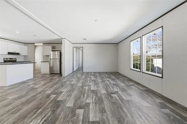 a view of a kitchen with a stove cabinets and wooden floor