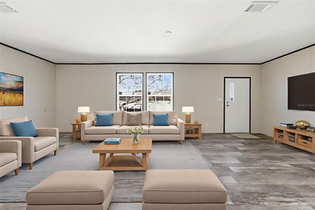 8551 Electra Avenue Brooksville, FL 34613 - Photo 21 of 54 a living room with furniture and a flat screen tv