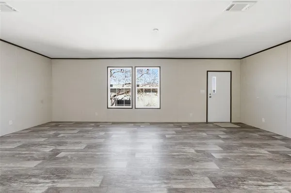 an empty room with windows
