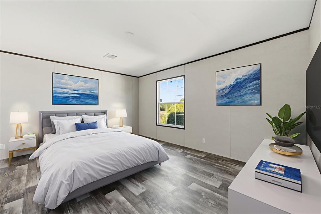 8551 Electra Avenue Brooksville, FL 34613 - Photo 26 of 54 a bedroom with a bed and a painting on the wall