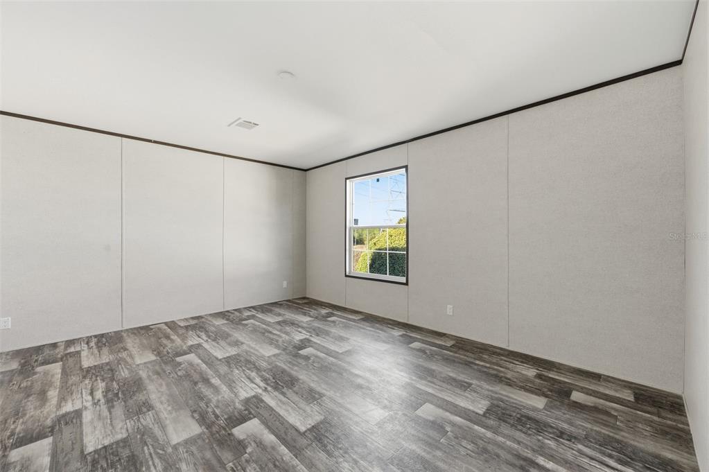 8551 Electra Avenue Brooksville, FL 34613 - Photo 27 of 54 a view of an empty room with a window