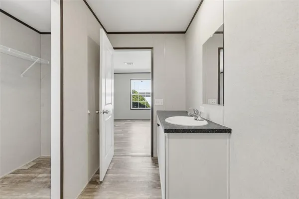 an aerial view of a house with a yard and wooden fence