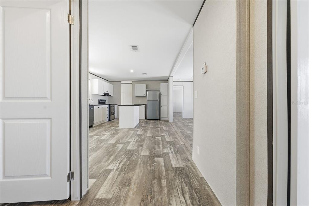 8551 Electra Avenue Brooksville, FL 34613 - Photo 51 of 54 a view of a hallway with wooden floor
