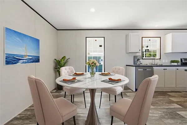 a dining room with furniture and window
