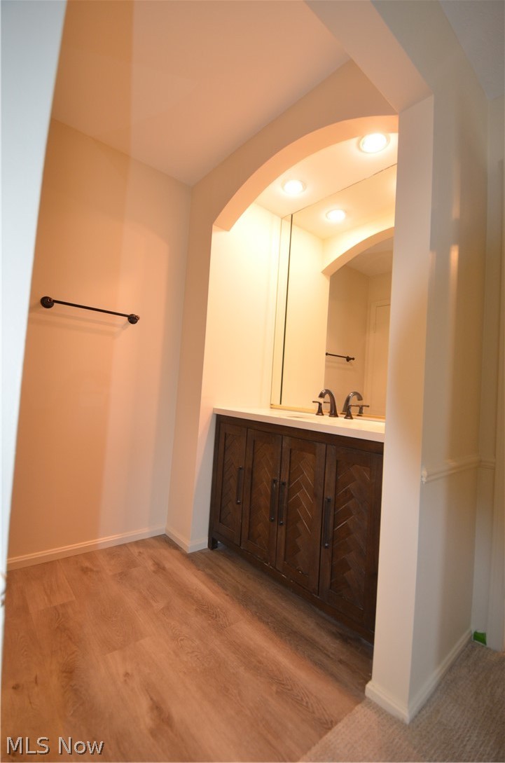 6933 West Fitzwater Road Brecksville, OH 44141 - Photo 12 of 18 Primary Bathroom from other angle with vanity, recessed lighting, and light wood-type flooring