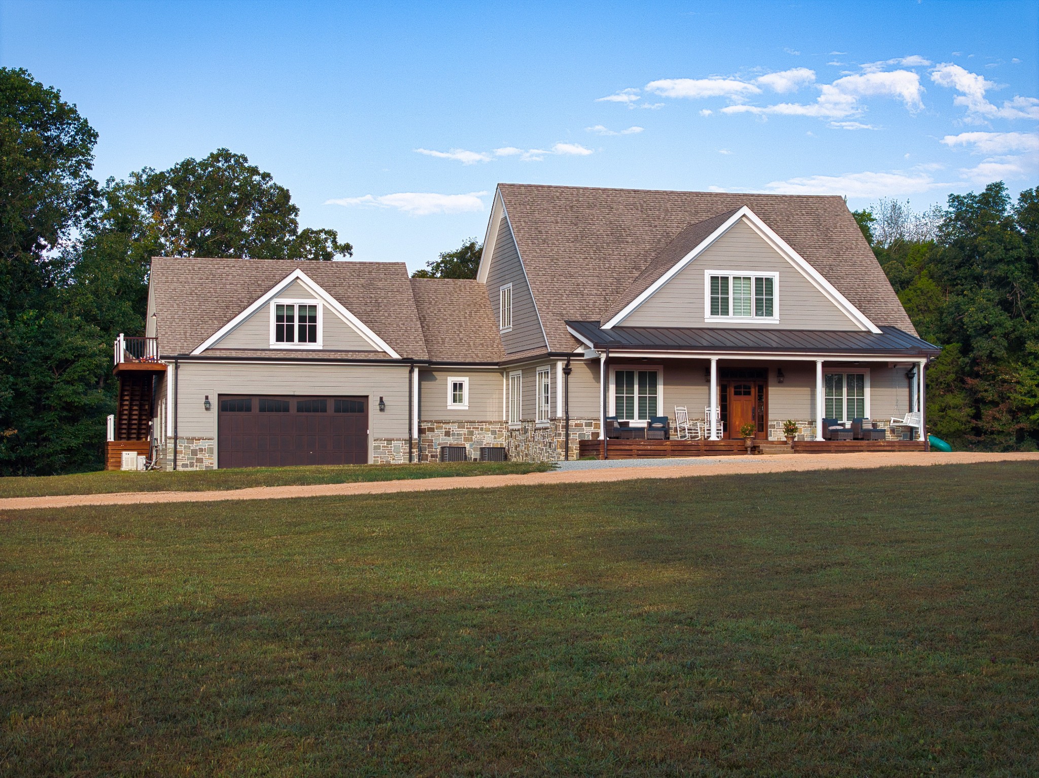 450 Lowe Branch Road Centerville, TN 37033 - Photo 3 of 100 a front view of a house with a garden