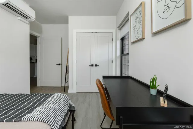 a view of a room with furniture and wooden floor