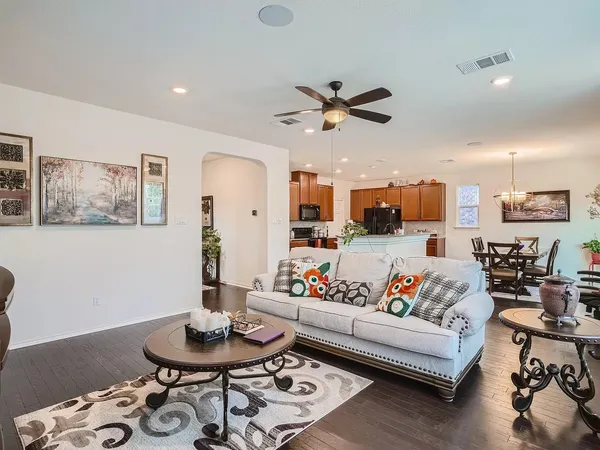 a kitchen with stainless steel appliances a sink stove and cabinets