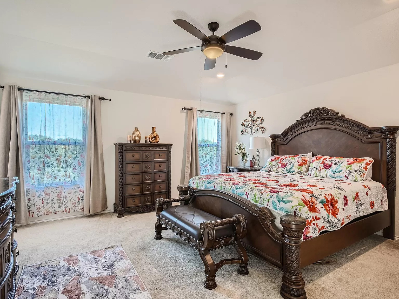 2471 Sunrise Road, Unit 64 Round Rock, TX 78664 - Photo 17 of 30 a bedroom with a bed and a chandelier
