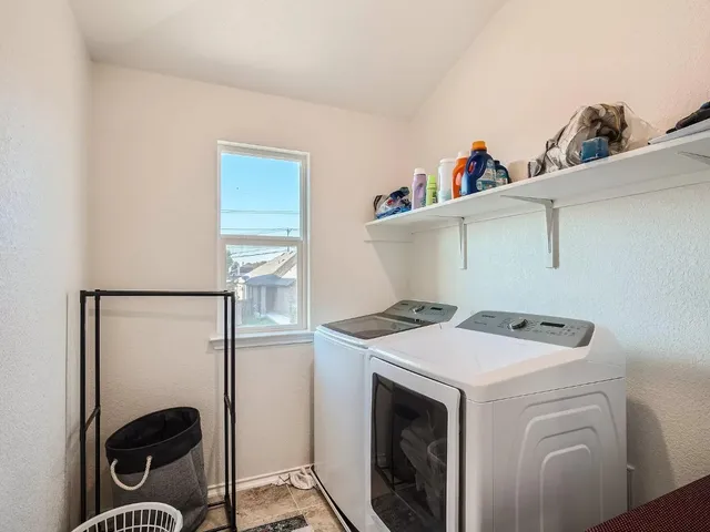 a view of workspace with windows recliner chair