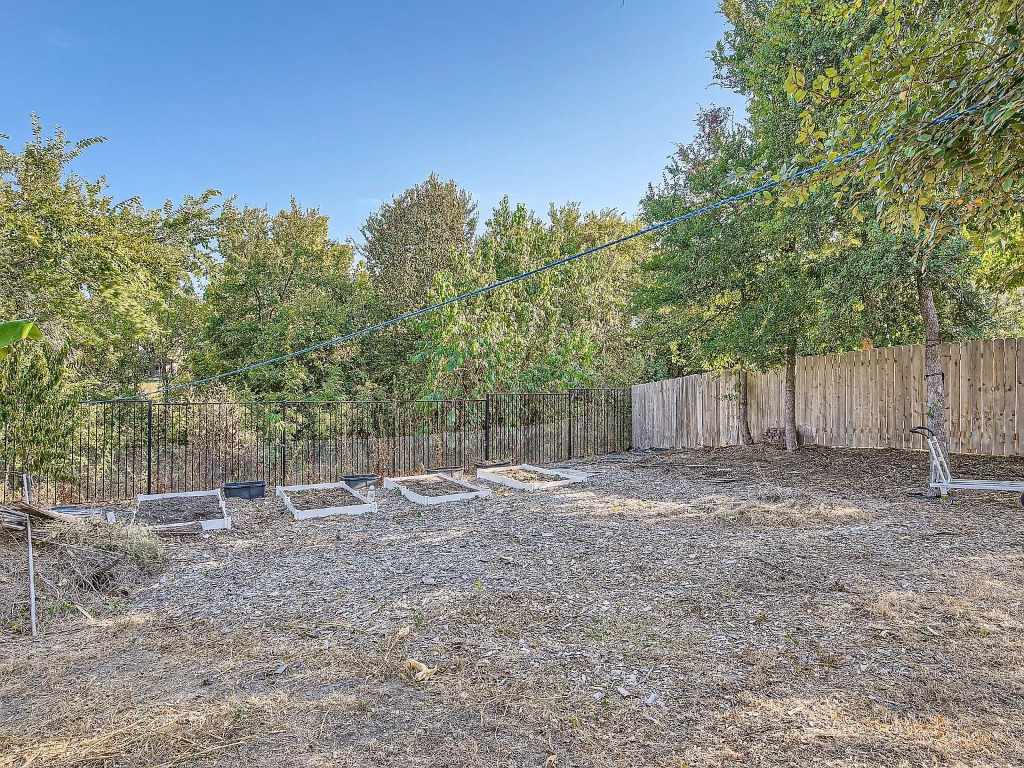 2471 Sunrise Road, Unit 64 Round Rock, TX 78664 - Photo 27 of 30 a view of a backyard with large trees