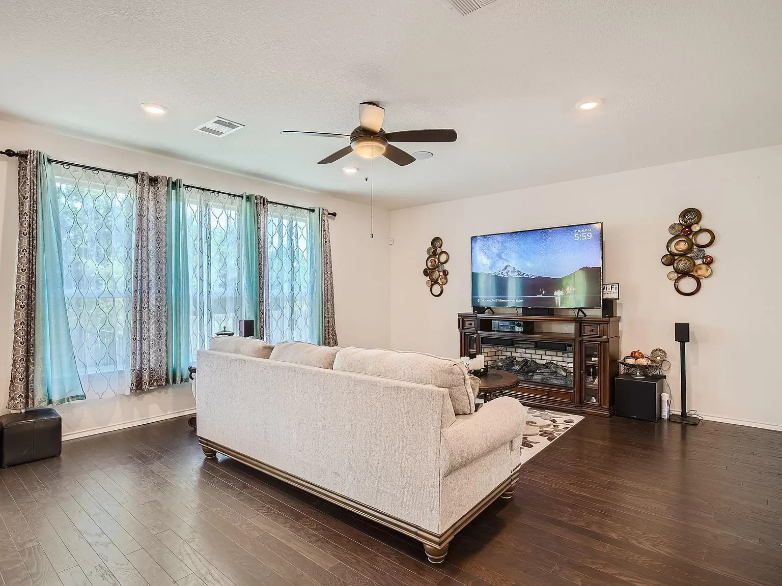 2471 Sunrise Road, Unit 64 Round Rock, TX 78664 - Photo 6 of 30 a living room with furniture and a flat screen tv