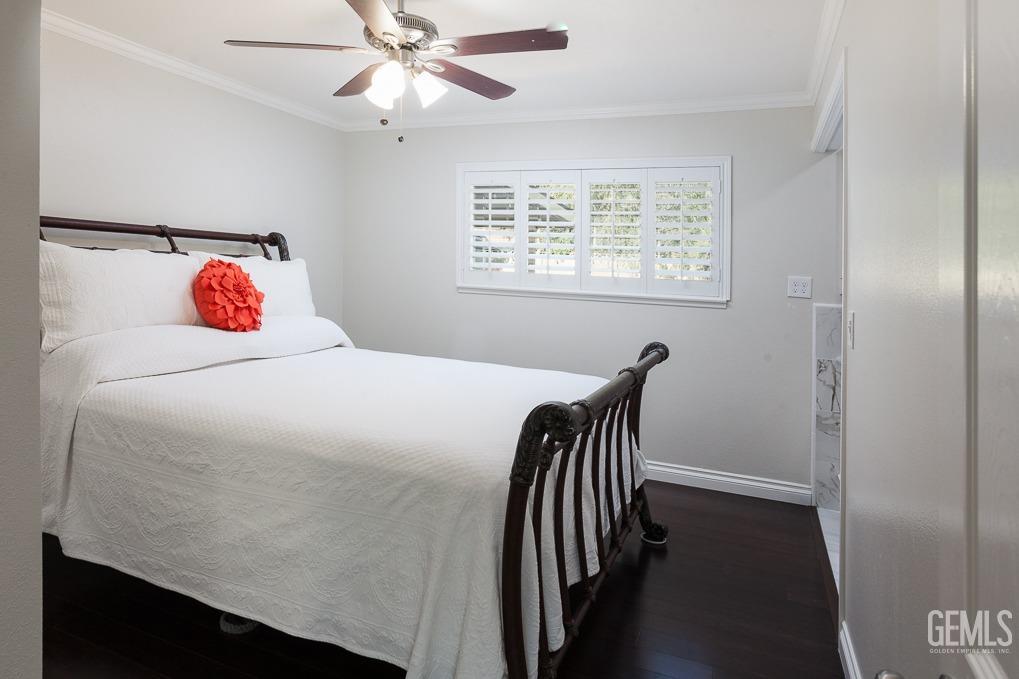 Undisclosed Address Ridgecrest, CA 93555 - Photo 12 of 23 a bedroom with a bed and a chandelier