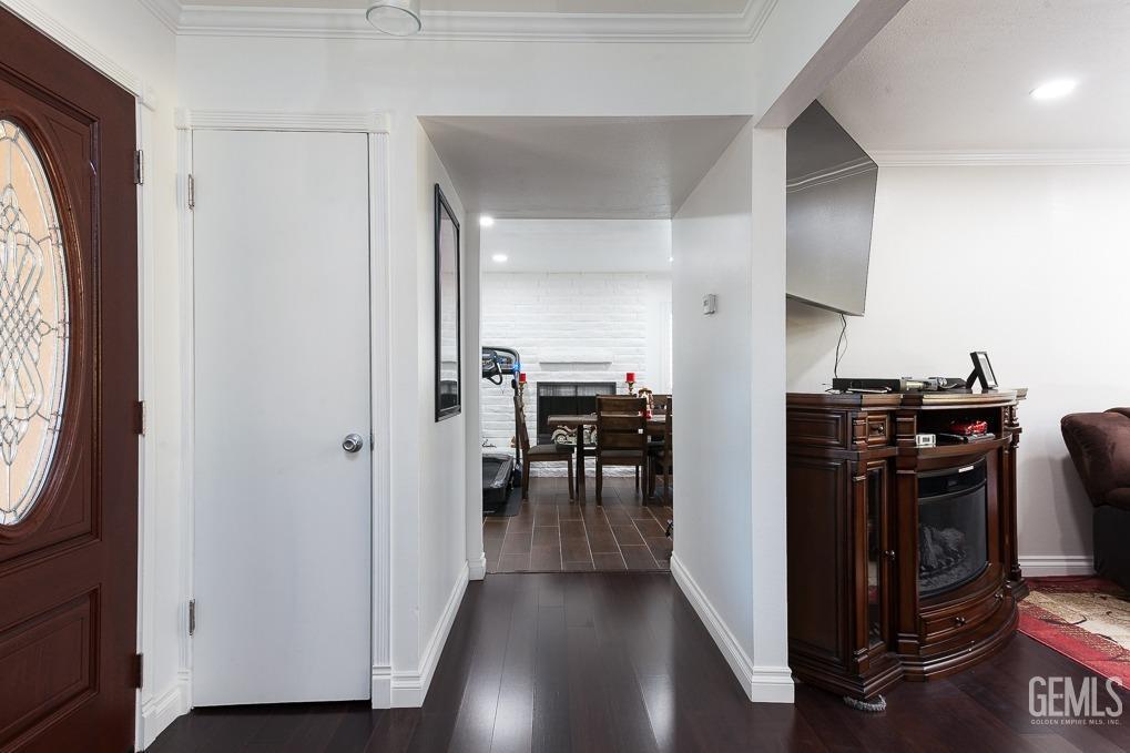 Undisclosed Address Ridgecrest, CA 93555 - Photo 7 of 23 a view of a hallway with workspace and wooden floor