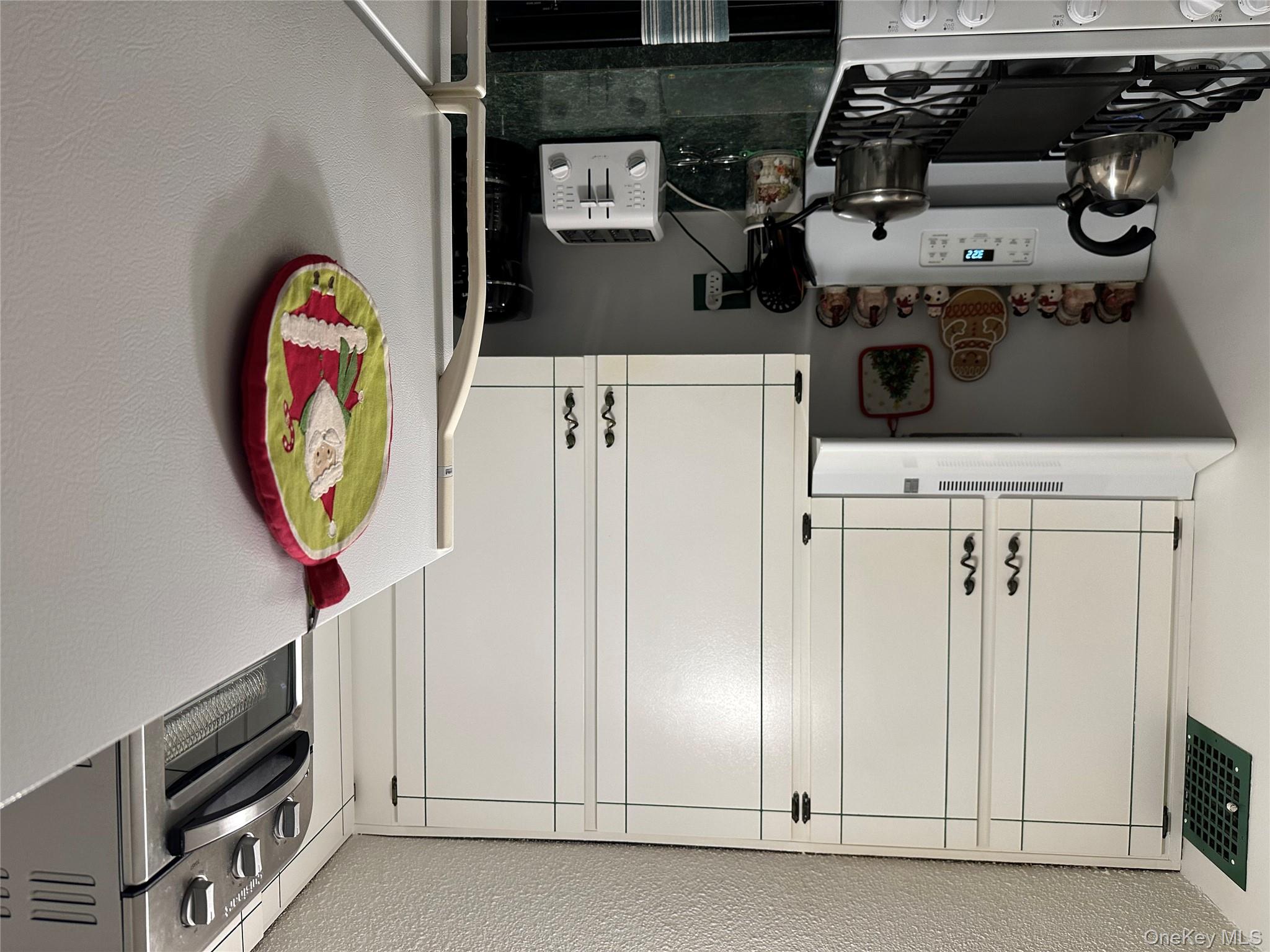 72-35 112th Street, Unit 2E Queens, NY 11375 - Photo 8 of 11 a kitchen with stainless steel appliances granite countertop a stove and a sink