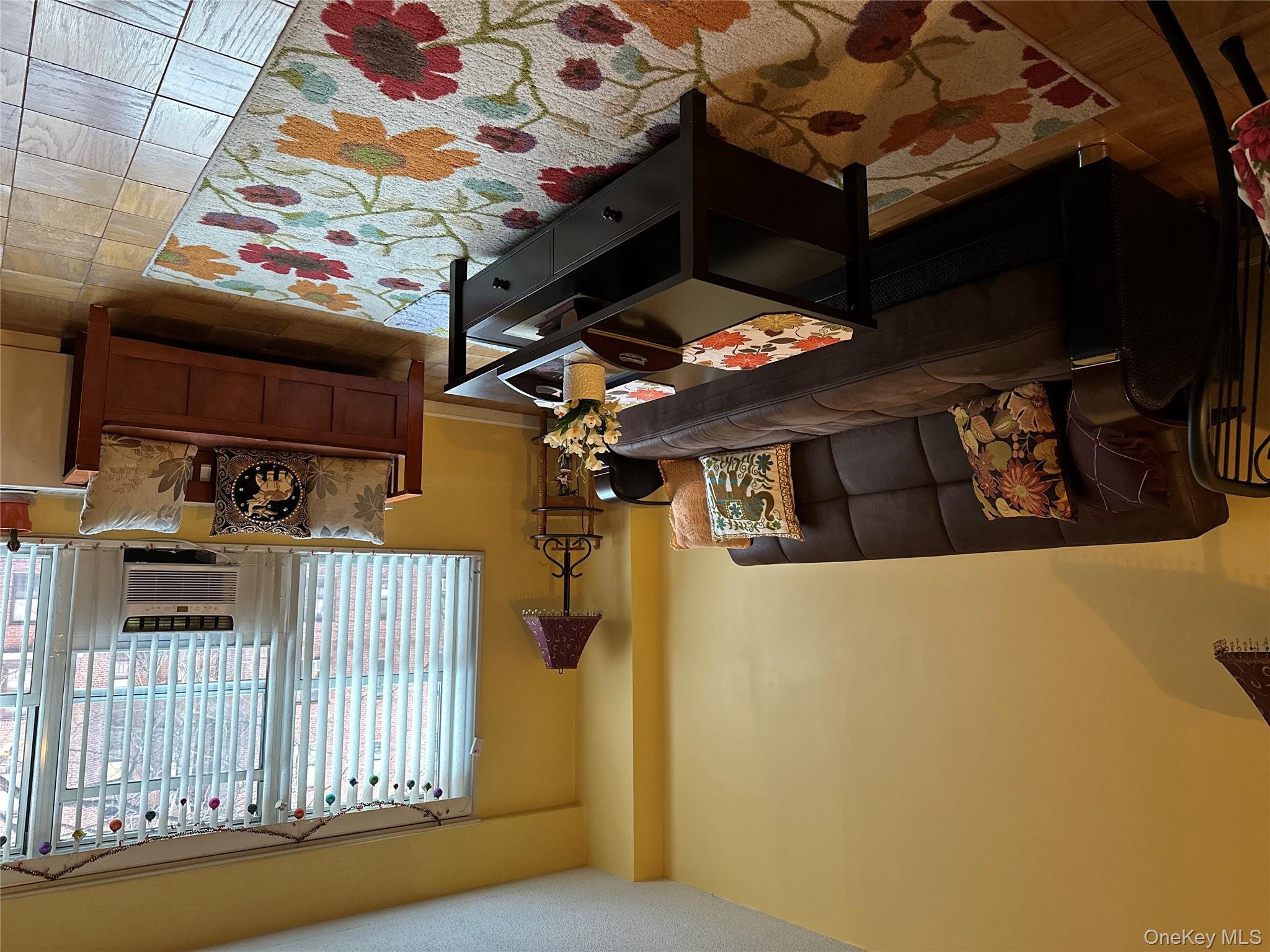 72-35 112th Street, Unit 2E Queens, NY 11375 - Photo 10 of 11 a living room with furniture and a flat screen tv