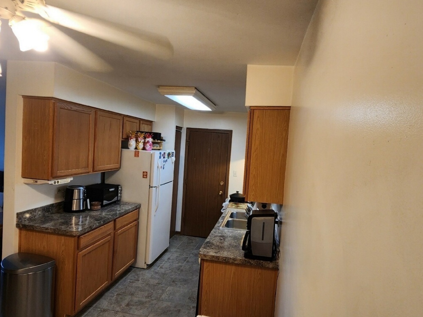 6440 Pamela Lane, Unit 12 Chicago Ridge, IL 60415 - Photo 2 of 15 a kitchen with a refrigerator and a stove top oven