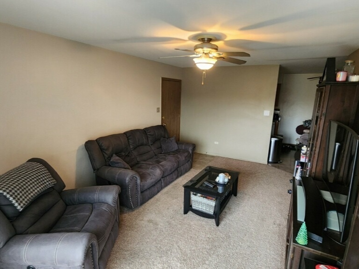 6440 Pamela Lane, Unit 12 Chicago Ridge, IL 60415 - Photo 6 of 15 a living room with furniture and a chandelier