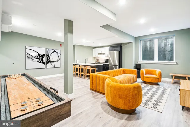 a living room with furniture and flat screen tv