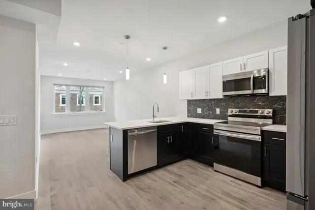 a bathroom with a toilet a sink and bathtub