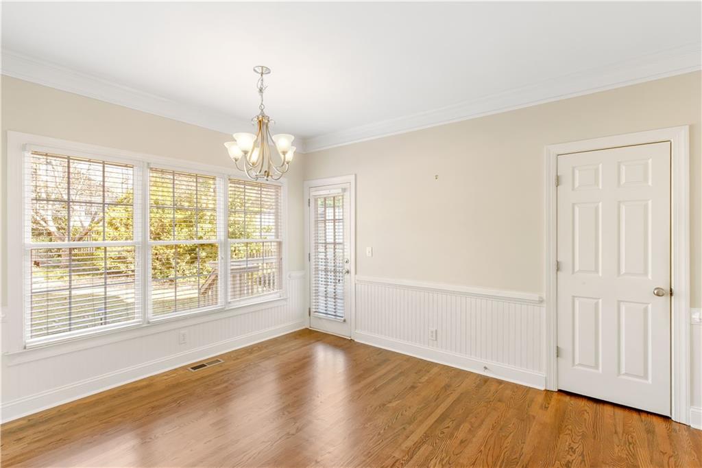 2020 Cockrell Run Northwest Kennesaw, GA 30152 - Photo 18 of 85 an empty room with wooden floor and windows