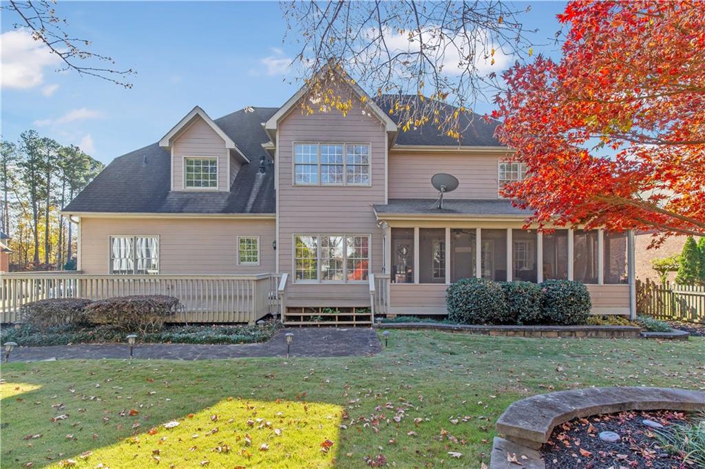 2020 Cockrell Run Northwest Kennesaw, GA 30152 - Photo 66 of 85 a front view of a house with a yard and outdoor seating