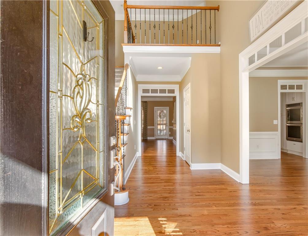 2020 Cockrell Run Northwest Kennesaw, GA 30152 - Photo 7 of 85 a view of a hallway with wooden floor and windows