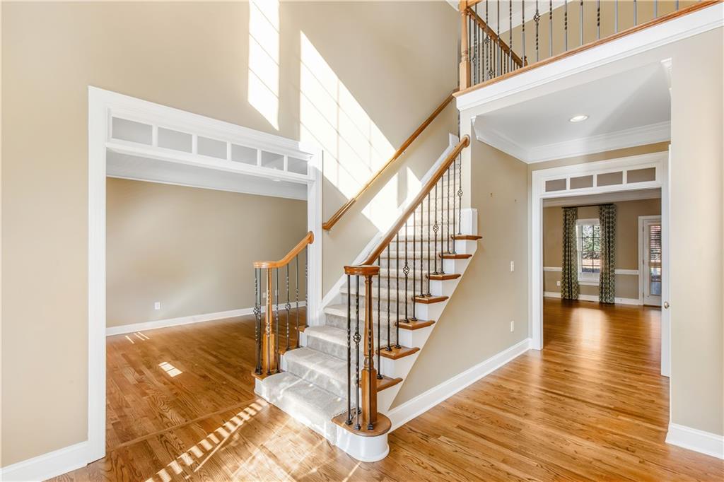 2020 Cockrell Run Northwest Kennesaw, GA 30152 - Photo 8 of 85 a view of a hallway with wooden floor and staircase