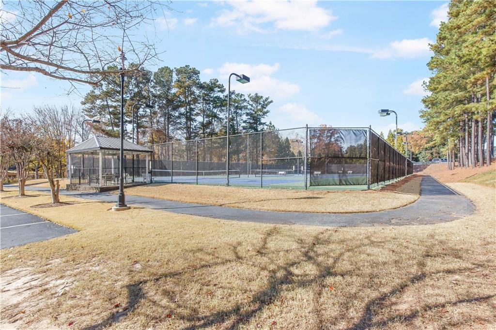 2020 Cockrell Run Northwest Kennesaw, GA 30152 - Photo 84 of 85 a view of outdoor space with swimming pool and trees in the background