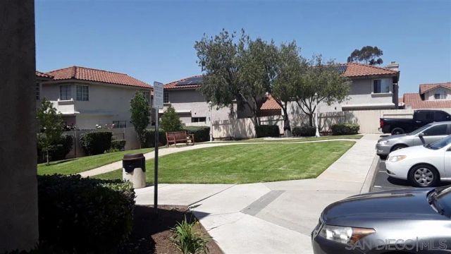 a view of a backyard with a garden and plants