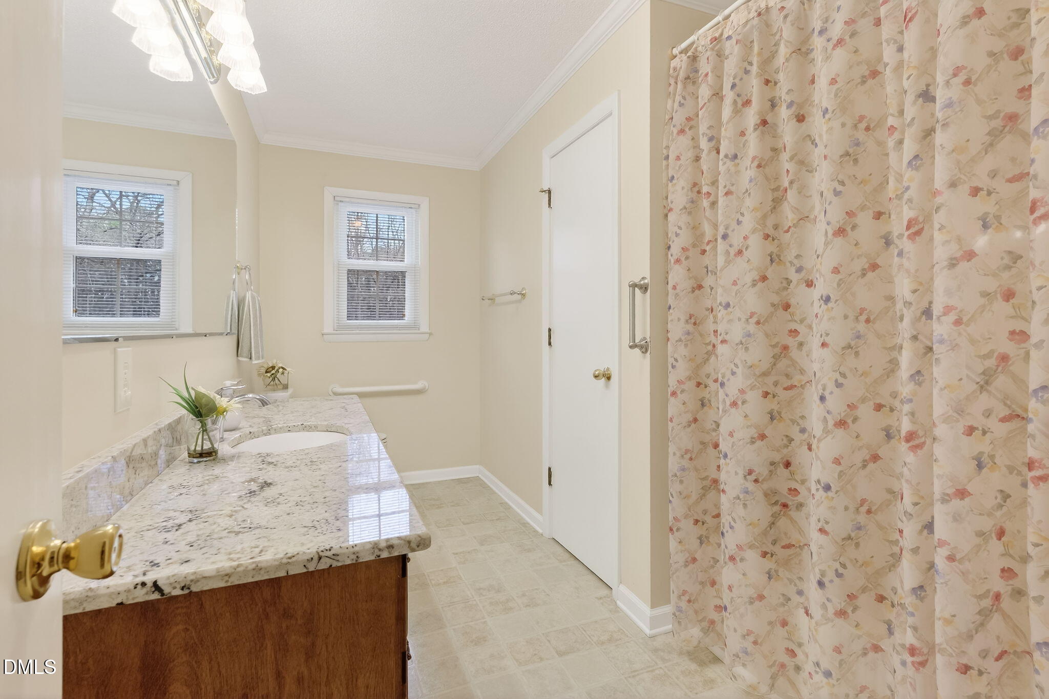 6313 Brack Penny Road Raleigh, NC 27603 - Photo 23 of 41 a bathroom with a granite countertop sink and a mirror