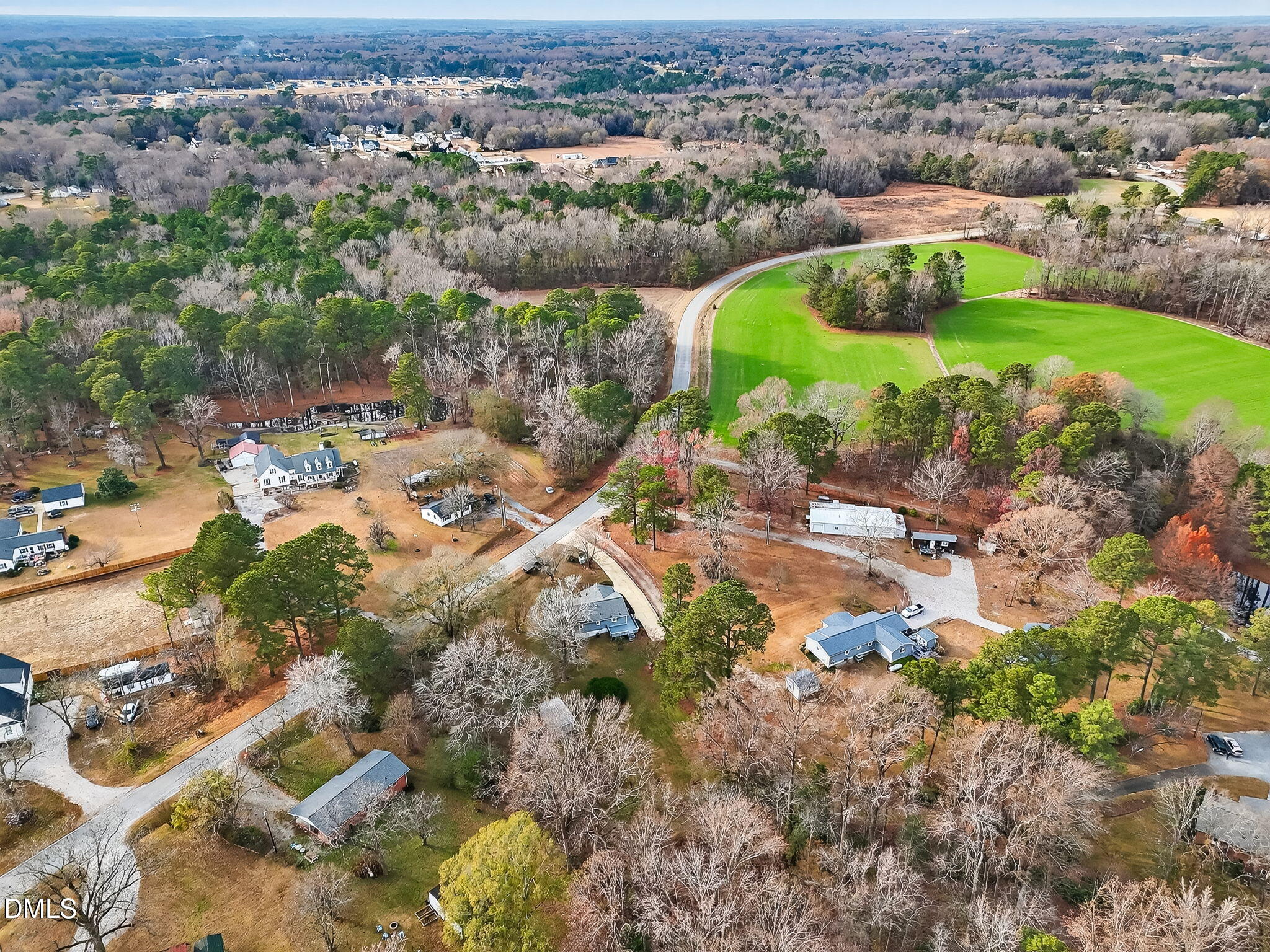 6313 Brack Penny Road Raleigh, NC 27603 - Photo 40 of 41 an aerial view of residential houses with outdoor space and trees