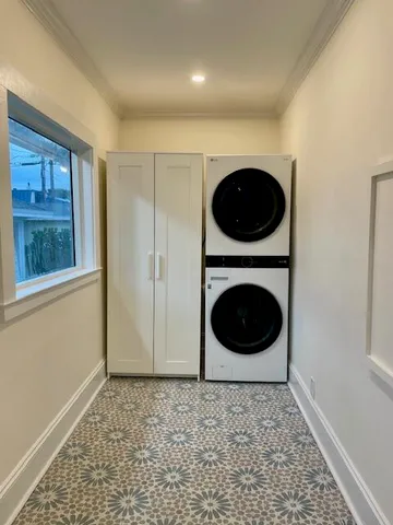 a living room with a fireplace and a rug