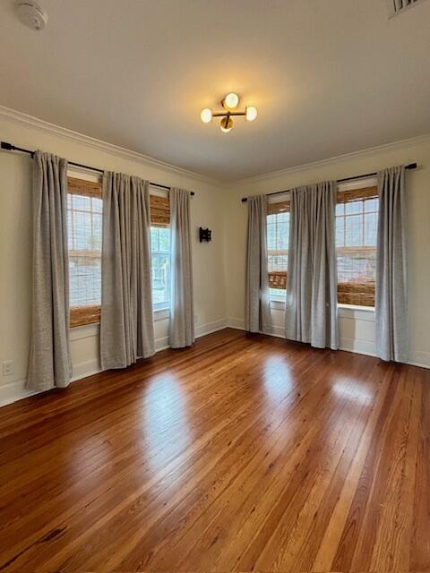 415 Upland Road West Palm Beach, FL 33401 - Photo 13 of 29 an empty room with wooden floor and windows