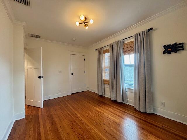 415 Upland Road West Palm Beach, FL 33401 - Photo 14 of 29 wooden floor in an empty room with a window