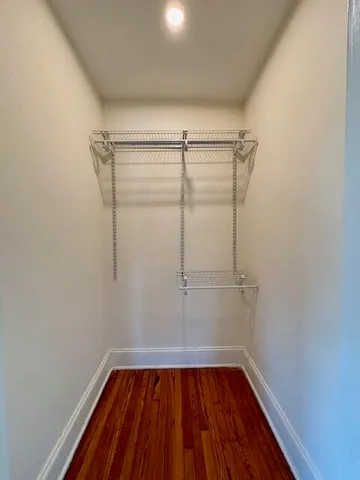 a view of a room with wooden floor