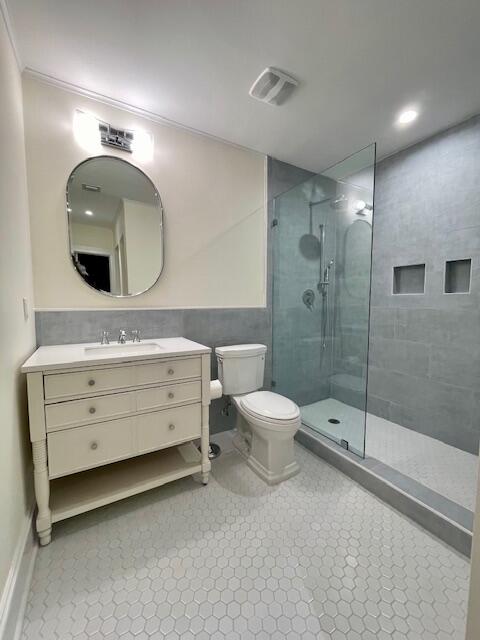 415 Upland Road West Palm Beach, FL 33401 - Photo 26 of 29 a bathroom with a double vanity sink toilet and shower
