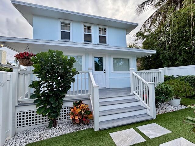 415 Upland Road West Palm Beach, FL 33401 - Photo 28 of 29 a view of a house with a yard and a garden