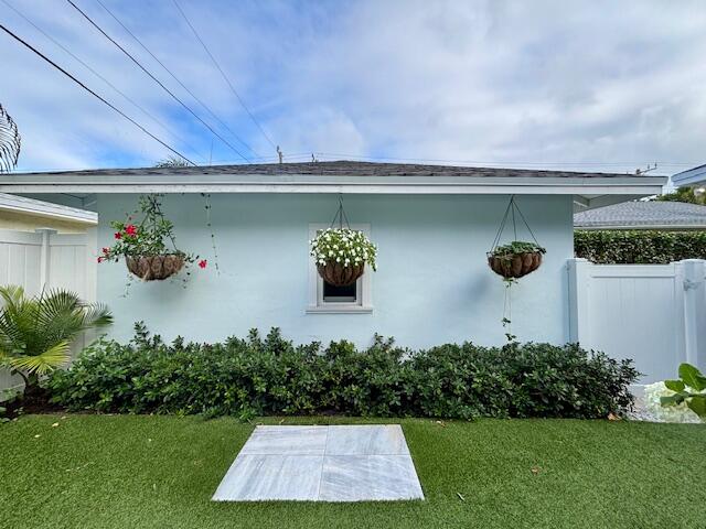 415 Upland Road West Palm Beach, FL 33401 - Photo 29 of 29 a front view of a house with garden