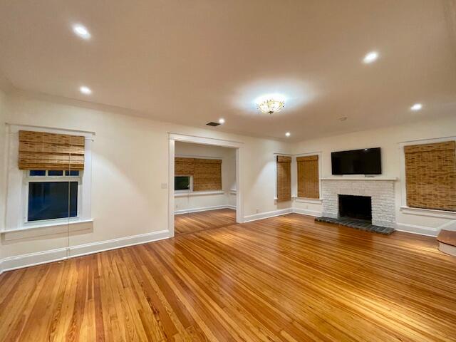 415 Upland Road West Palm Beach, FL 33401 - Photo 4 of 29 a view of empty room with wooden floor and fireplace